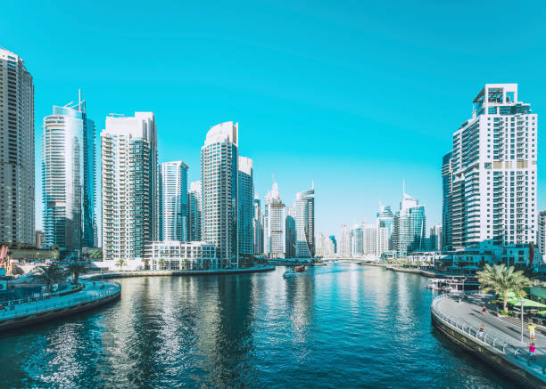 Panoramic view of Dubai Marina's skyscrapers reflecting on the water, illustrating prime real estate choices.