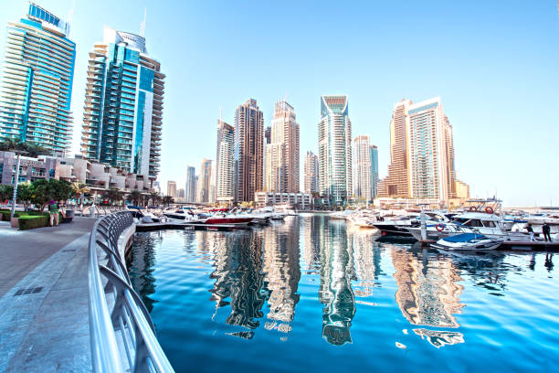 Reflection of Dubai Marina's skyscrapers on water, illustrating prime property locations for potential buyers.