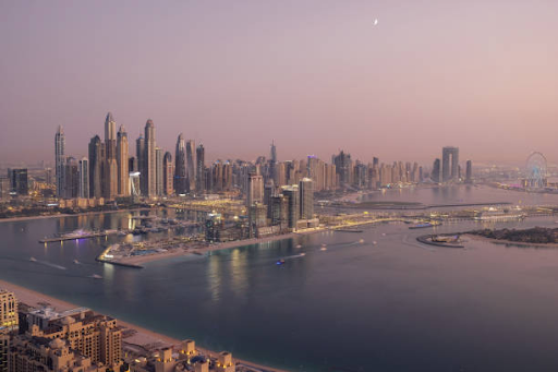 Aerial view of Dubai's futuristic skyline at twilight, showcasing the luxurious rental options in Binghatti Hills.